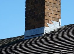 Waterproofing chimneys with flashing